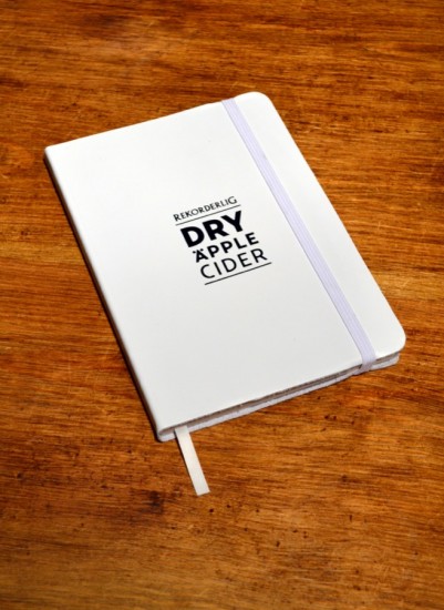 customized notebook with black foil on white leather manufactured by Book Block customized journals made to roder