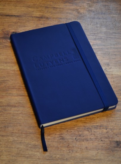 Promotional Notebooks made with leather and debossed logo and matching ribbon and elastic hand made by Book Block