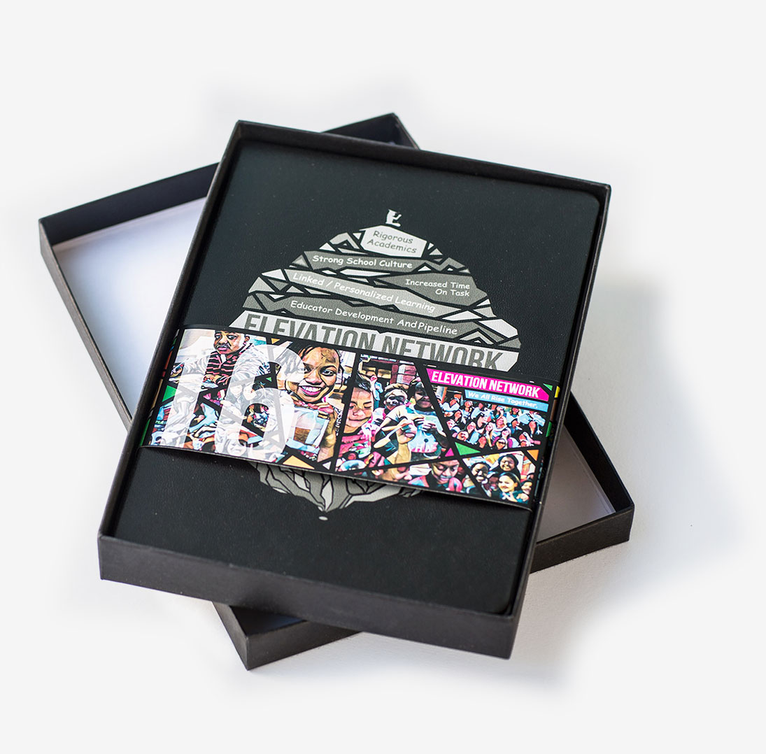 Notebook with a bellyband sitting in a presentation box