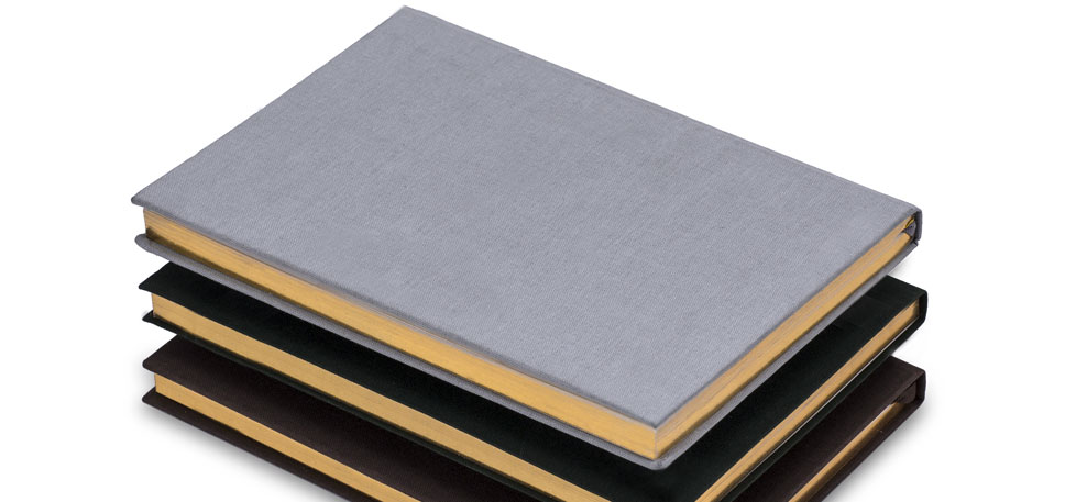 Set of 3 grey and black notebooks with gold edging
