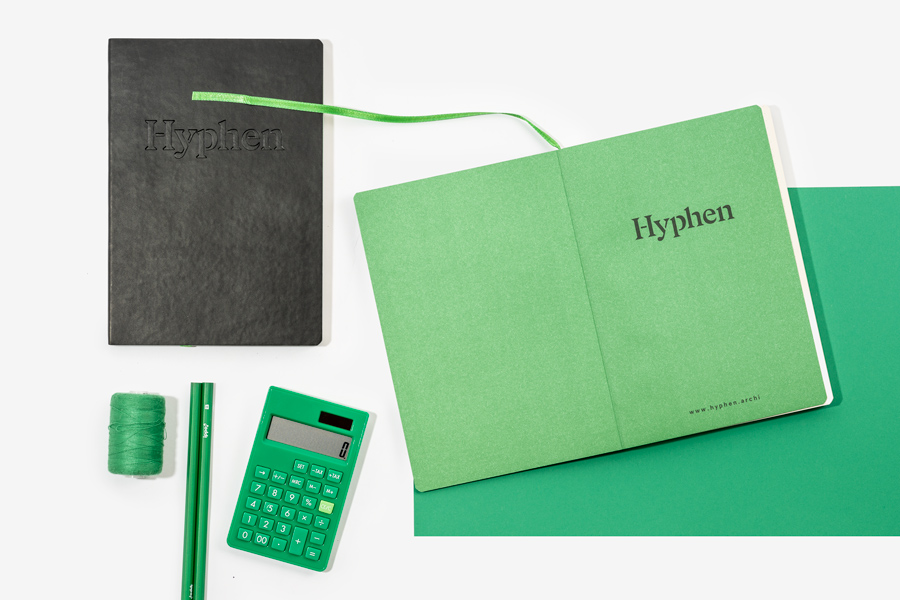Open notebook with green printed endpapers and debossed black faux leather notebook cover Open notebook with green printed endpapers and debossed black faux leather notebook cover