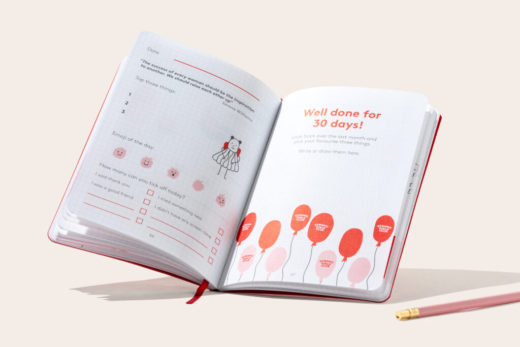 Inside pages of Strong Girls Club x HappySelf journal notebooks with printed pages